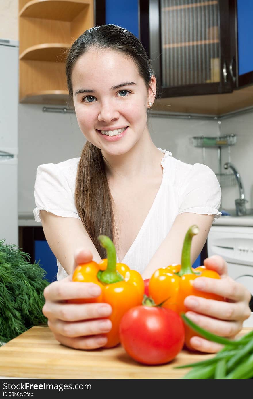 Young beautiful caucasian woman in the kitchen