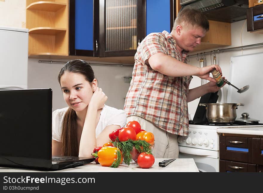 Young beautiful caucasian woman in the kitchen