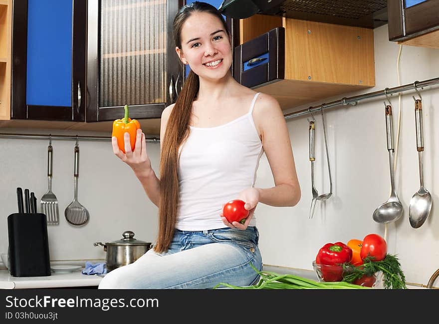 Young Beautiful Caucasian Woman In The Kitchen