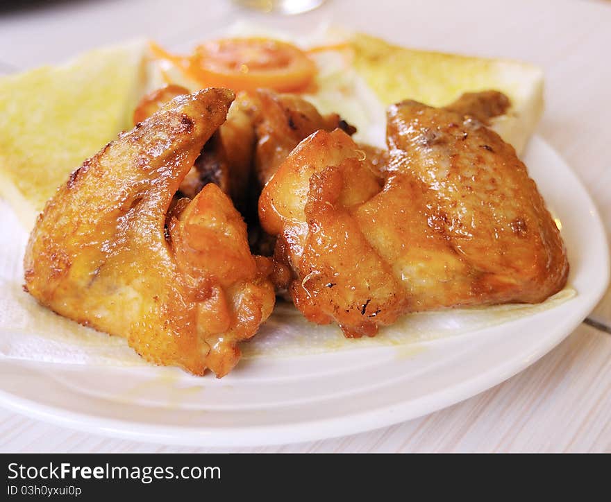 Golden brown fried chicken drumsticks