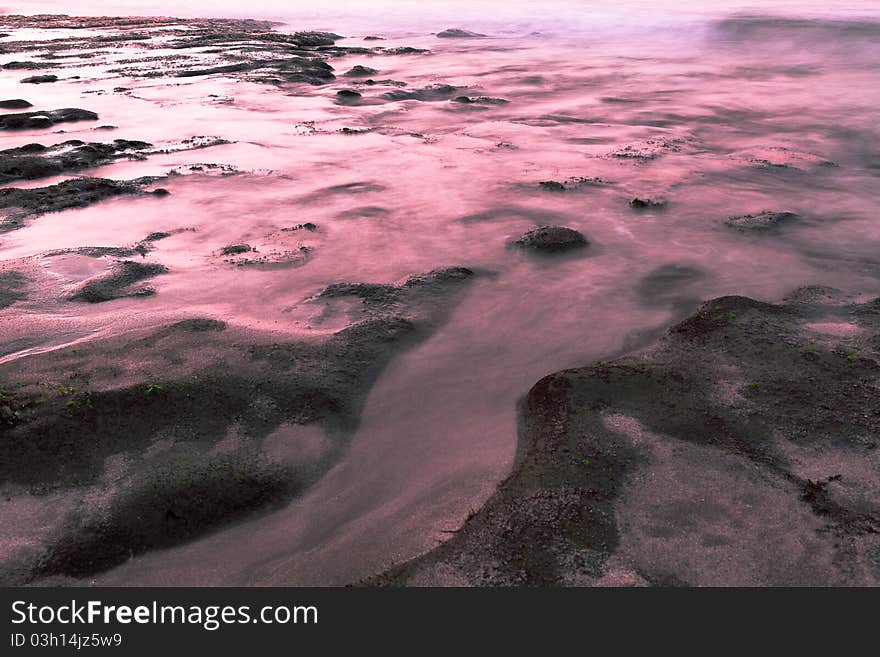 Sunset, rocks and sea.