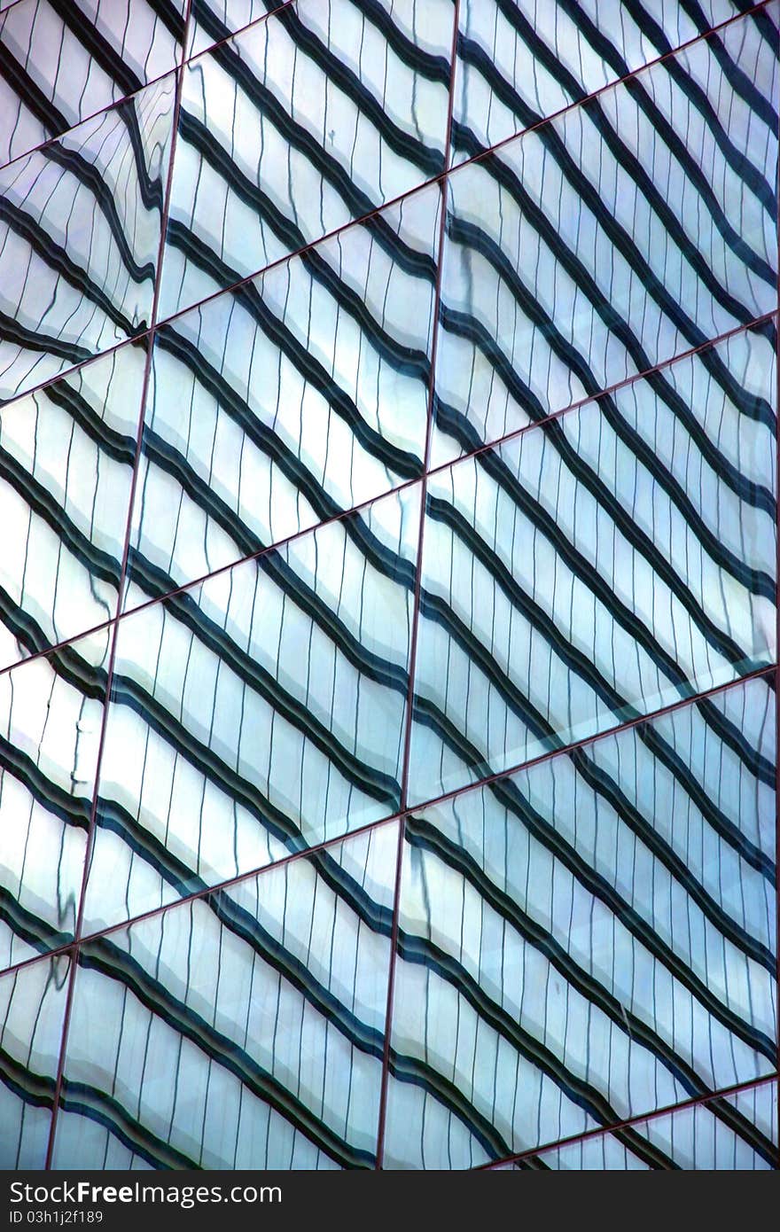 Modern building reflected on glass surface. Modern building reflected on glass surface