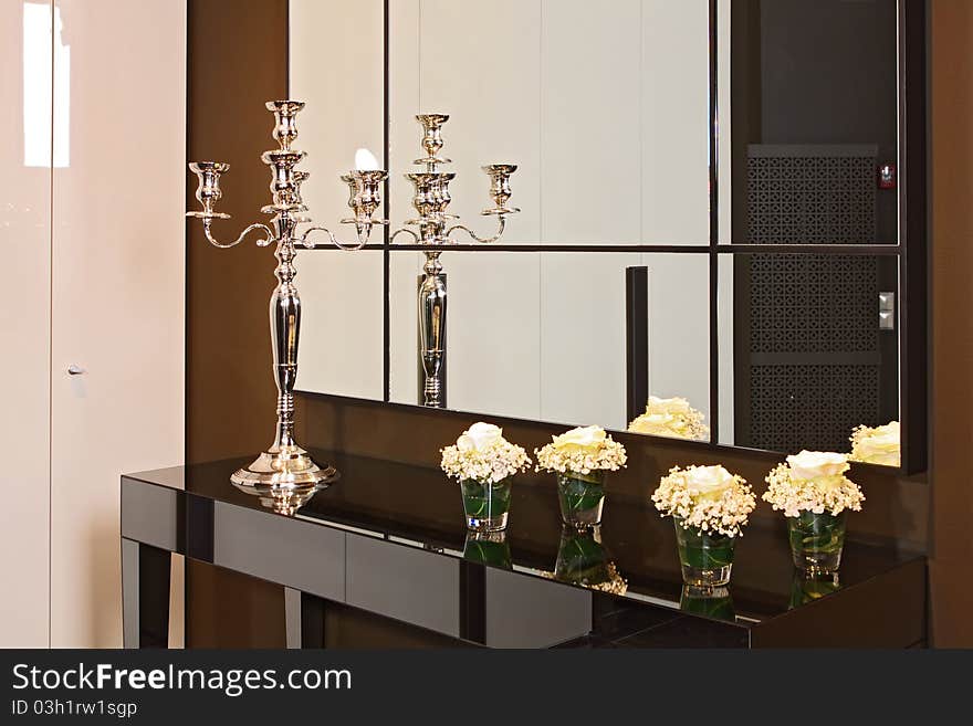 Spacious modern lobby with the big mirror and a bench from a skin