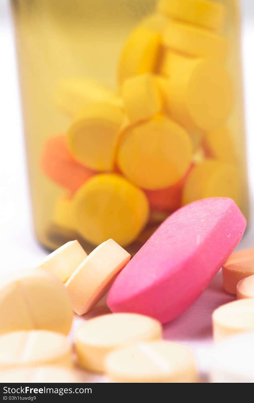 A bottle of medicines with white isolated background. A bottle of medicines with white isolated background