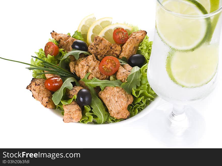 Chicken and vegetable salad with ice cold drink isolated over white background. Chicken and vegetable salad with ice cold drink isolated over white background