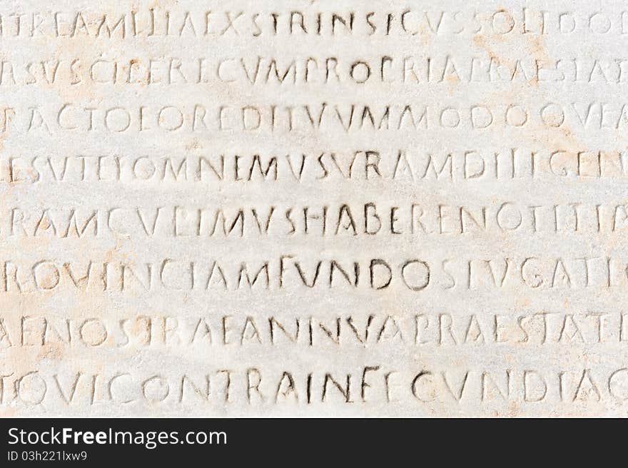 Closeup of ancient latin text carved on marble, Ephesus, Turkey