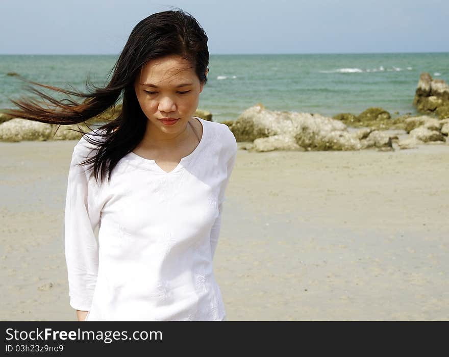 Young Woman On The Beach