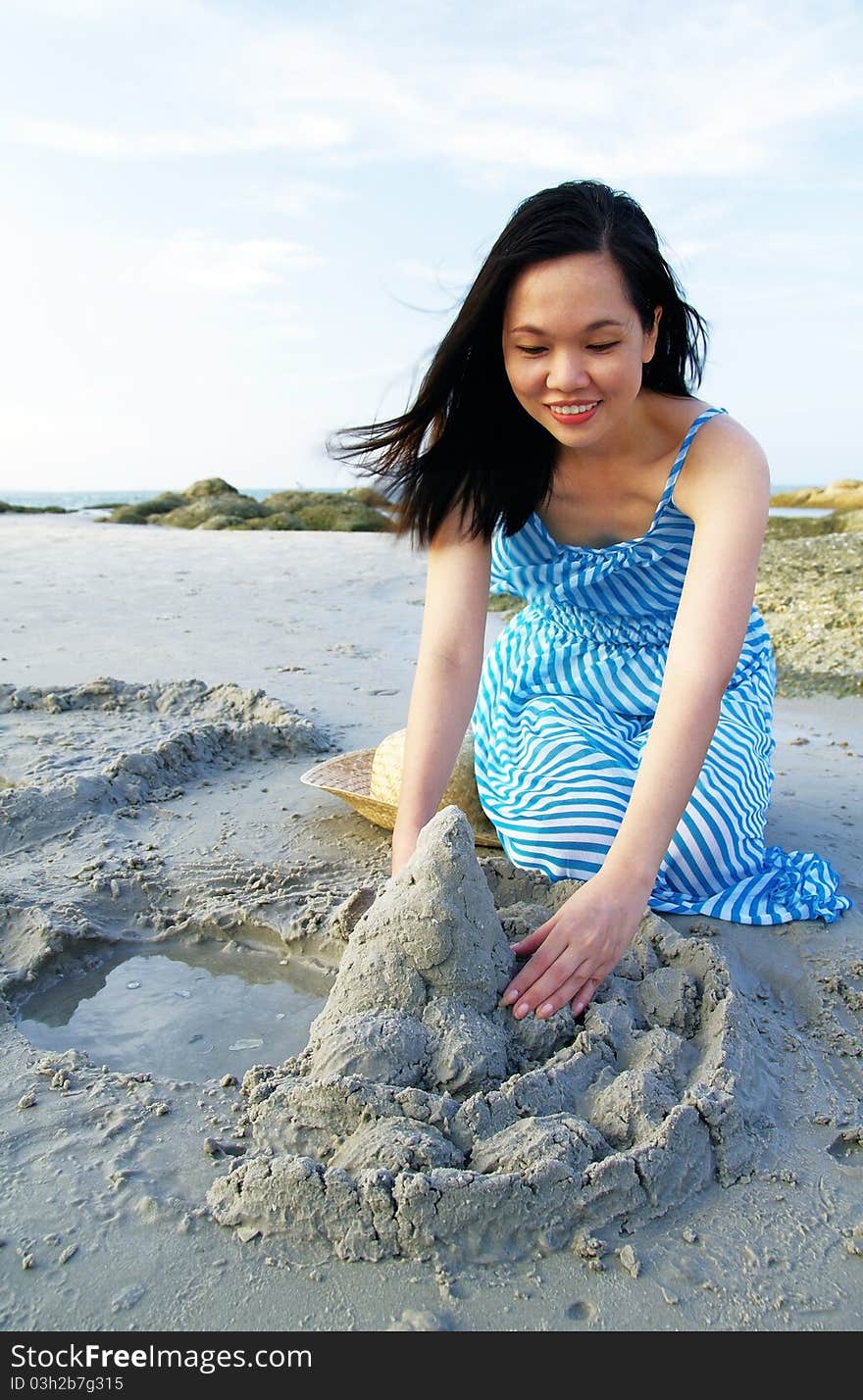 Portrait of young woman on the beach