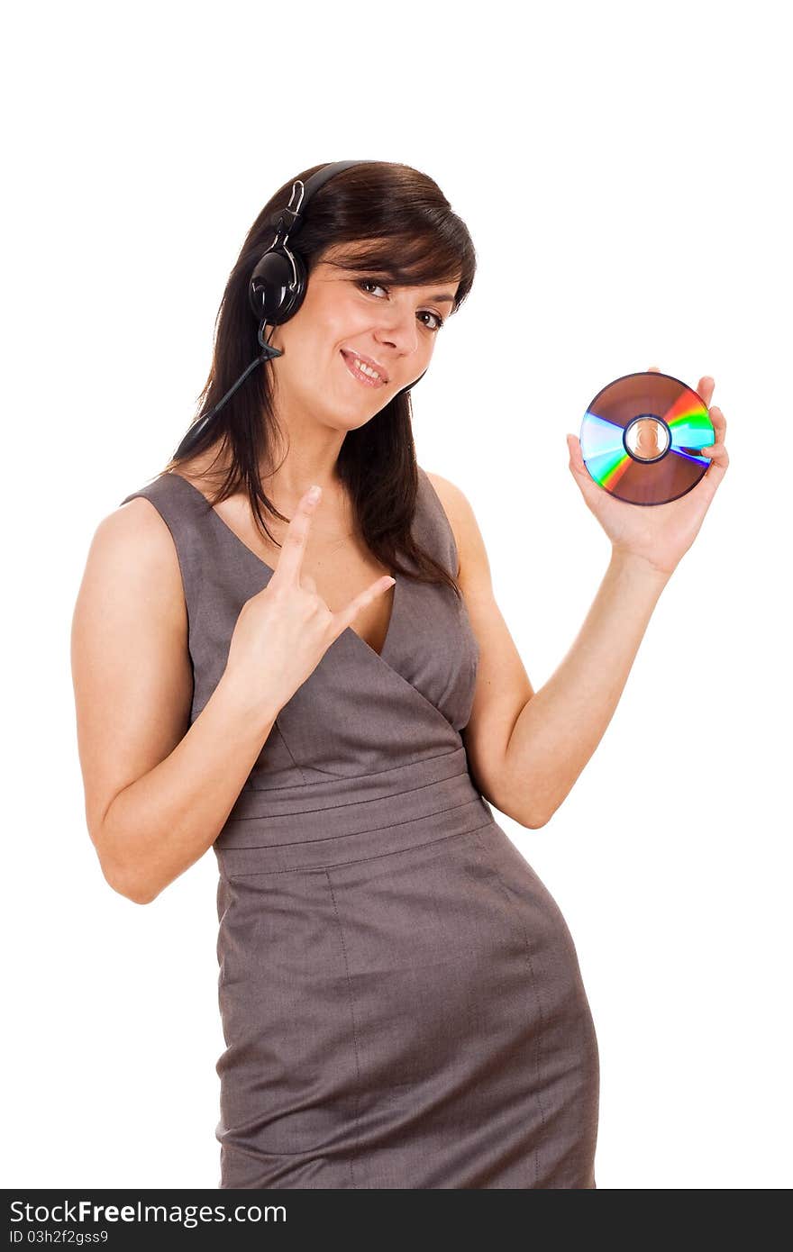 Pretty young lady listening to music and holding CD. Isolated on white background. Pretty young lady listening to music and holding CD. Isolated on white background