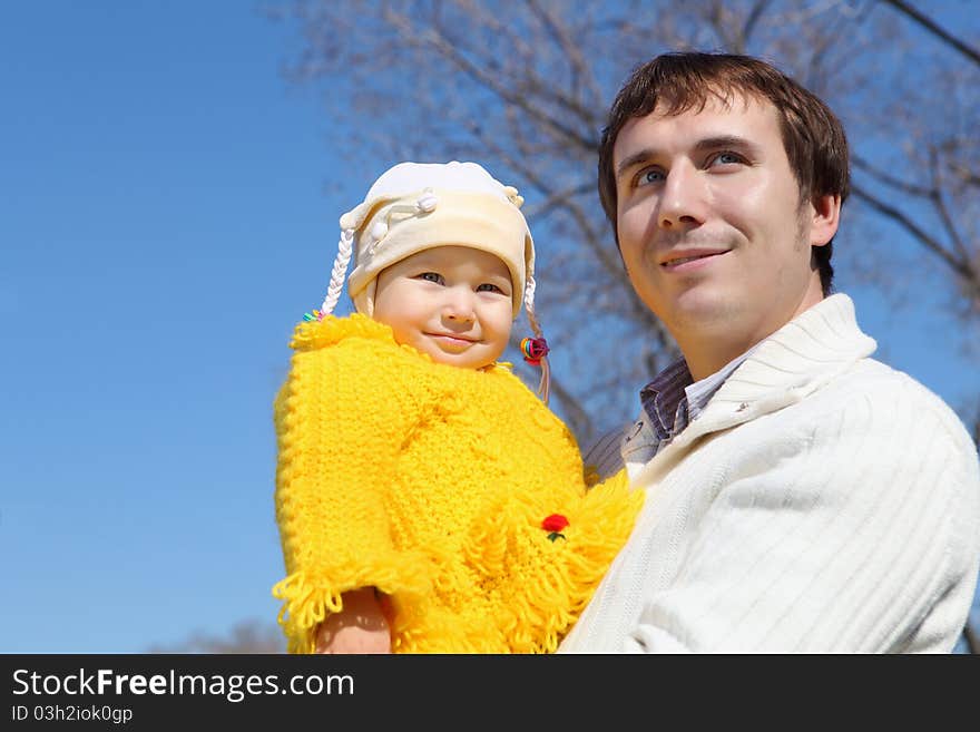 Little girl with her father in spring park