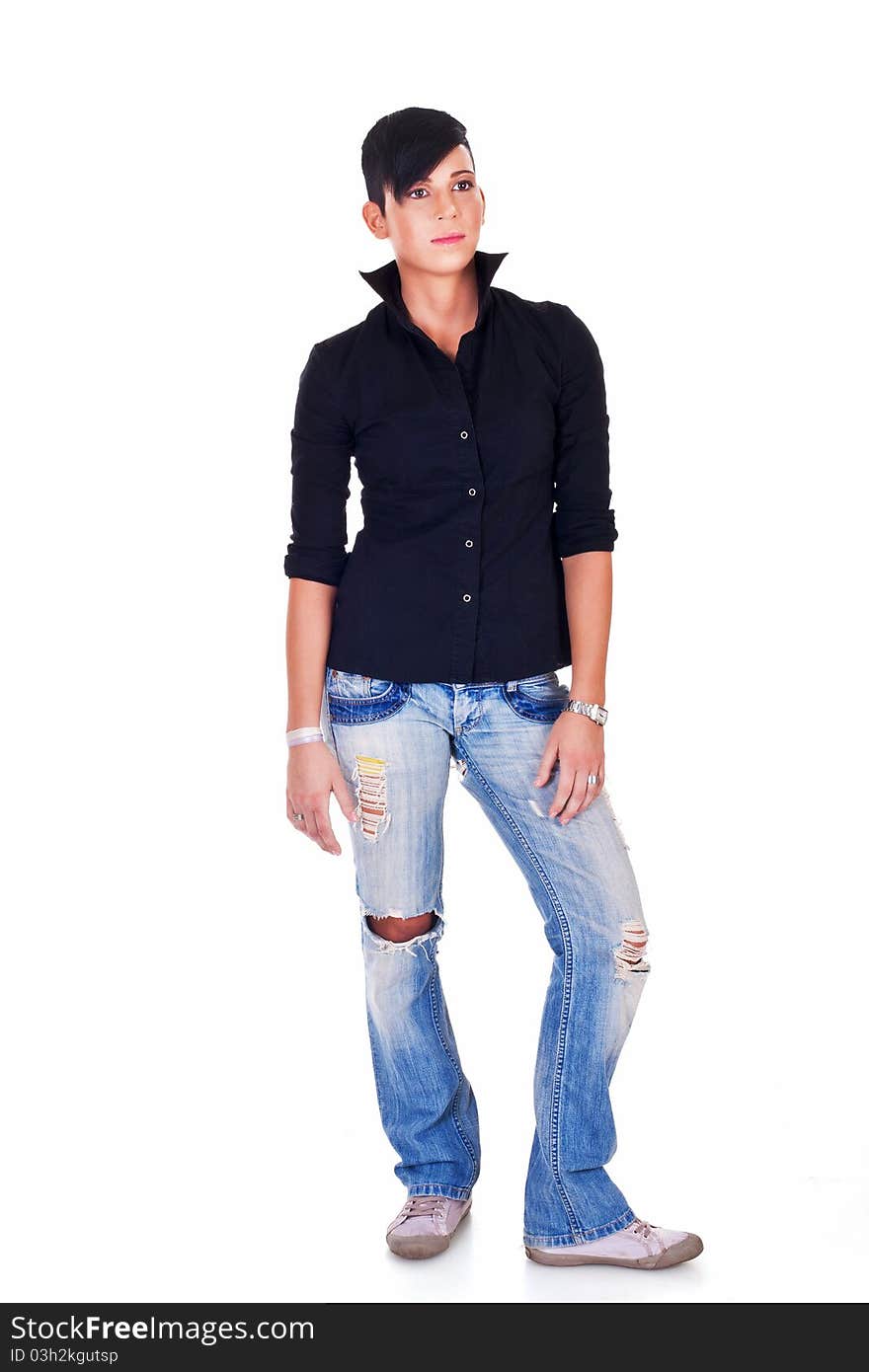 Beautiful short haired young Caucasian woman in blue jeans, over white background