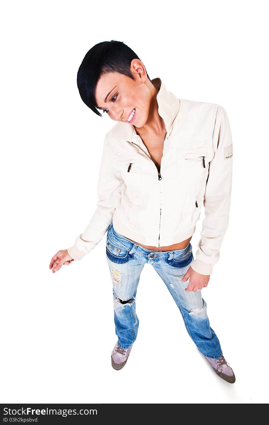 Beautiful short haired young Caucasian woman in blue jeans, over white background