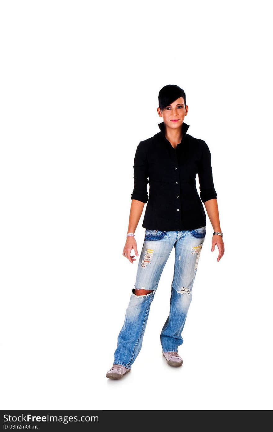 Beautiful short haired young Caucasian woman in blue jeans, over white background