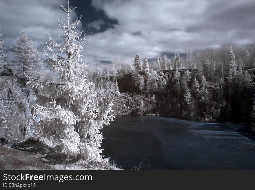 Mountain and frozen lake and cloudy sky. Mountain and frozen lake and cloudy sky