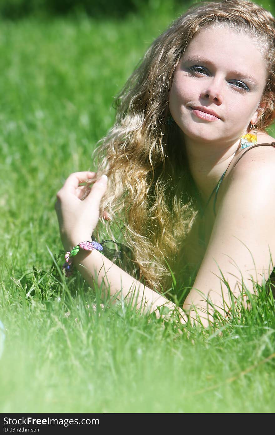 Young attractive woman on natural background