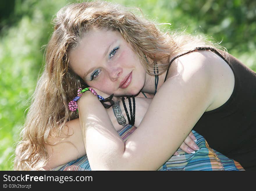 Young attractive woman on natural background