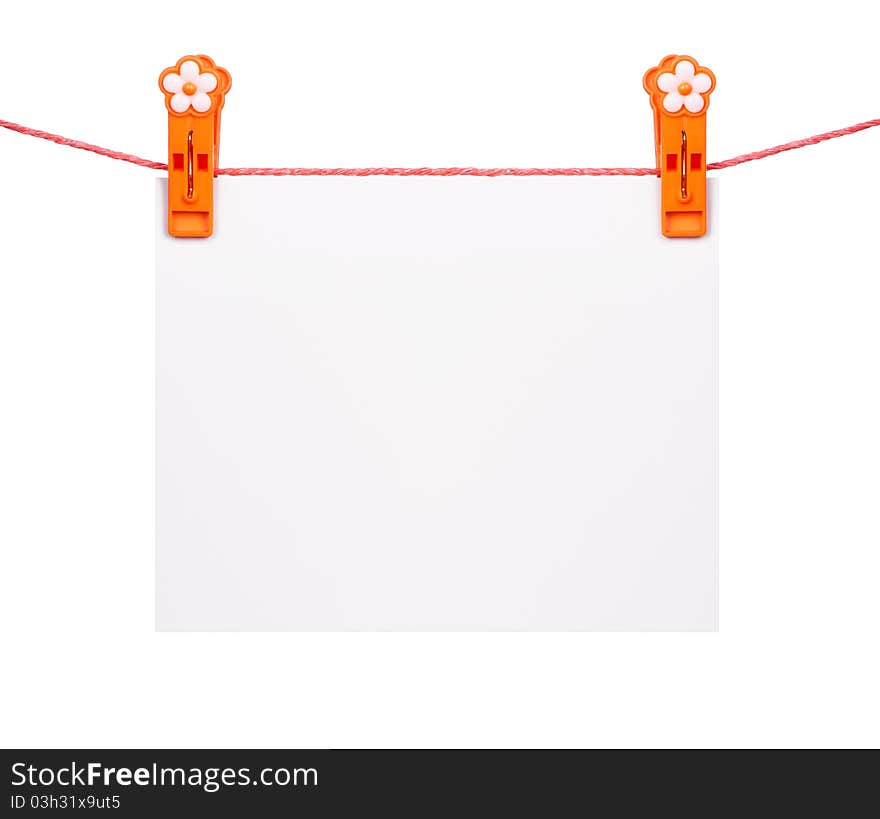 White blank with clothespins hanging on the clothesline isolated over white background