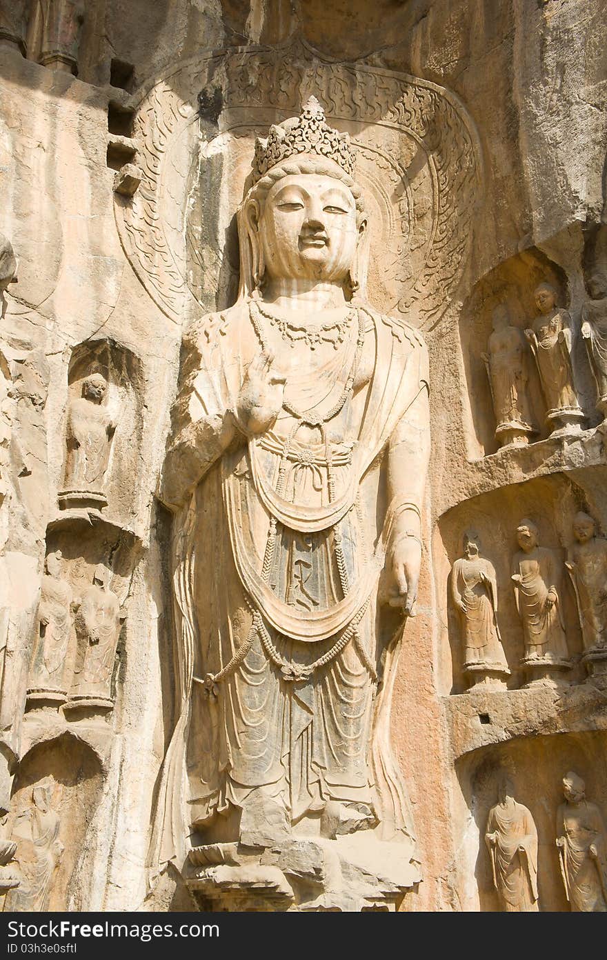 Buddha statue figure of bodhisattva in Longmen Grottoes. The Longmen Grottoes with Buddha's figures are located on both banks of the Yi River, near Luoyang City, Henan province, China. Protected by UNESCO. Buddha statue figure of bodhisattva in Longmen Grottoes. The Longmen Grottoes with Buddha's figures are located on both banks of the Yi River, near Luoyang City, Henan province, China. Protected by UNESCO.