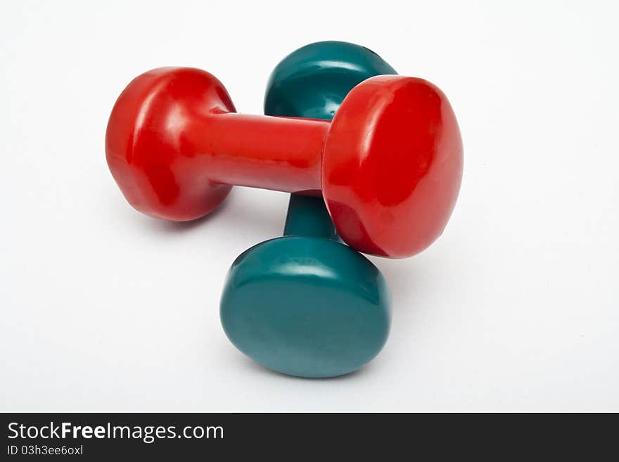 Red and green dumbbells hand weight.