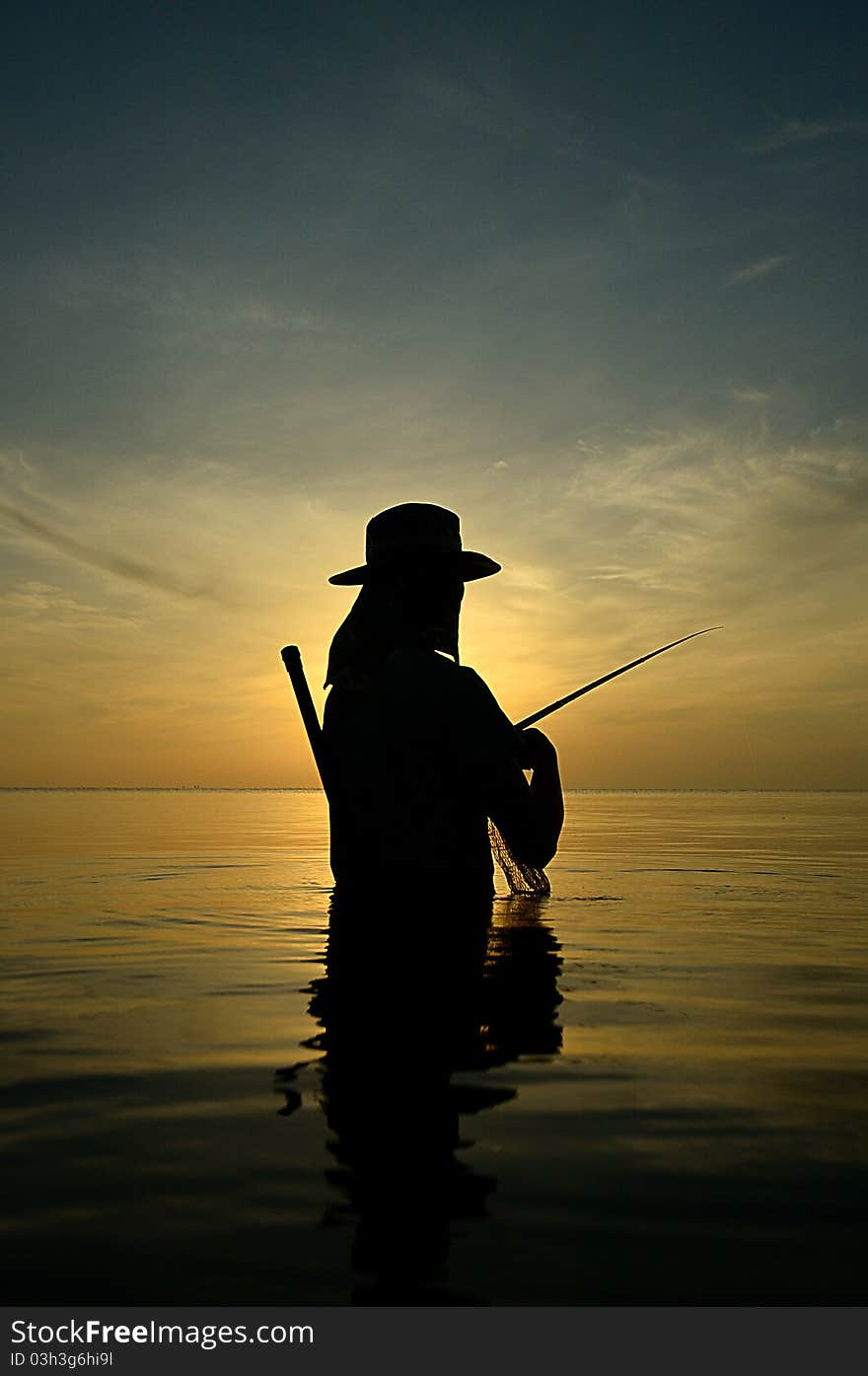 Silhouette fishing on morning at 06.30 AM