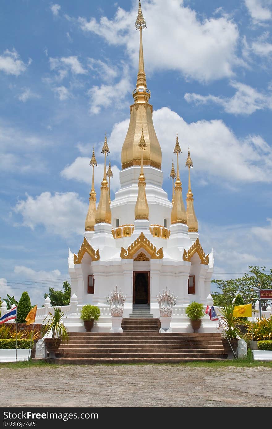 Golden Pagoda and blue sky in Wat Tham Khuha Sawan,Ubonratchathanee Province, Thailand.