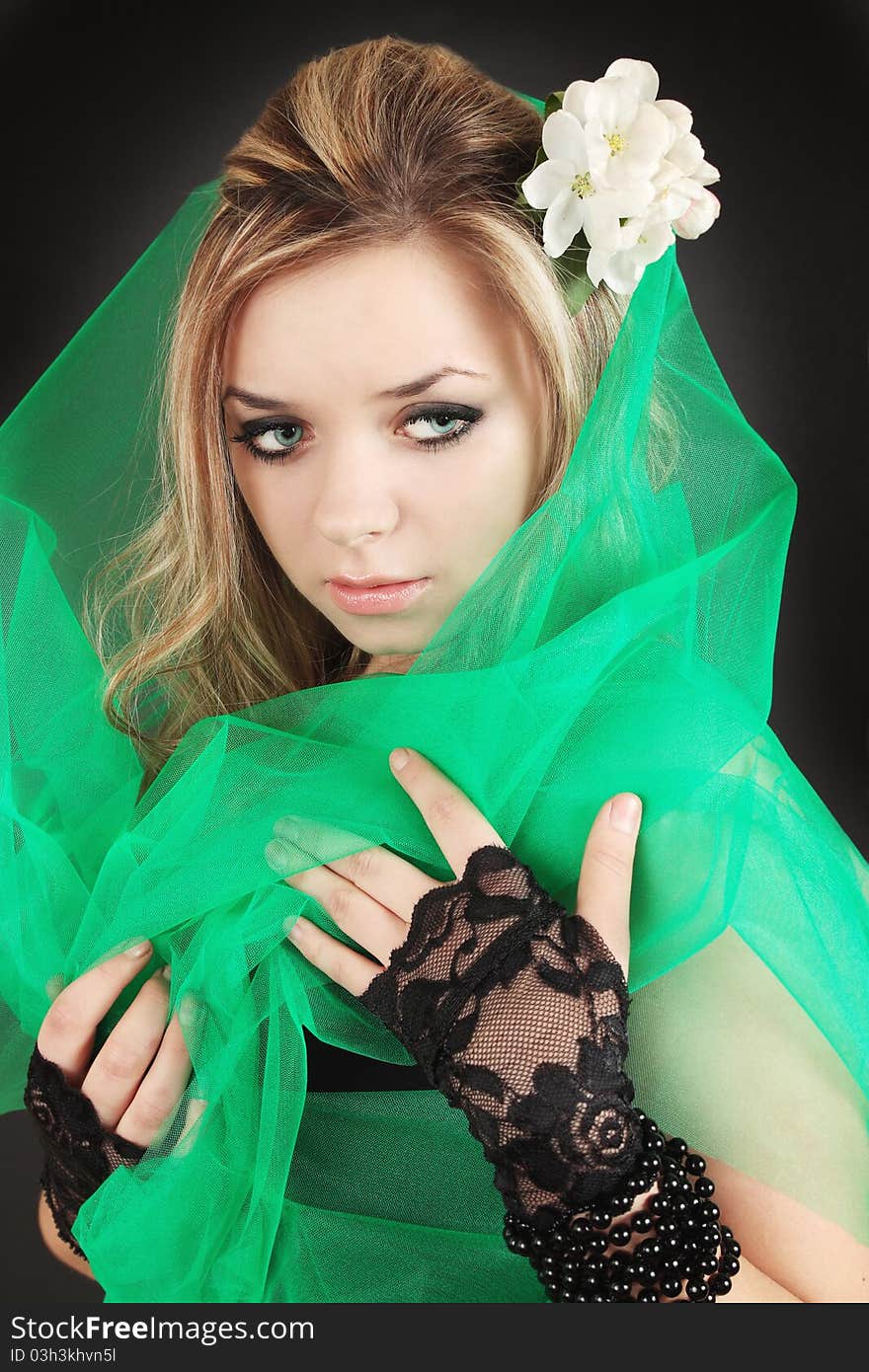 Girl with the flower in the green the veil. Girl with the flower in the green the veil