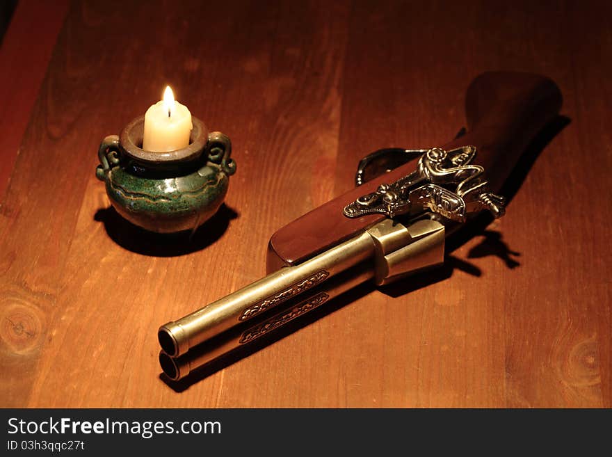 Ancient Pistol And Candle