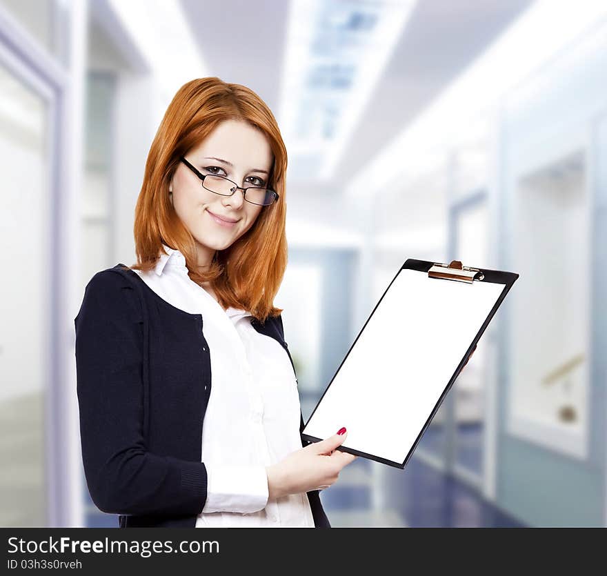 Portrait of the business woman with a represent folder. Studio shot.