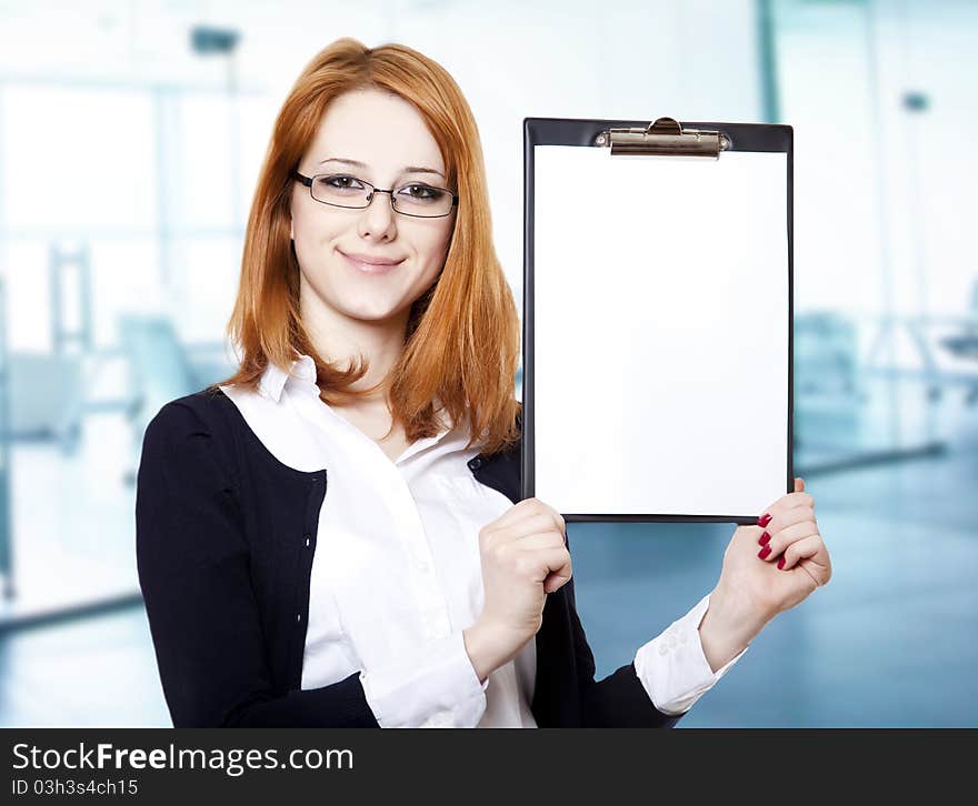 Portrait of the business woman with a represent folder. Studio shot.