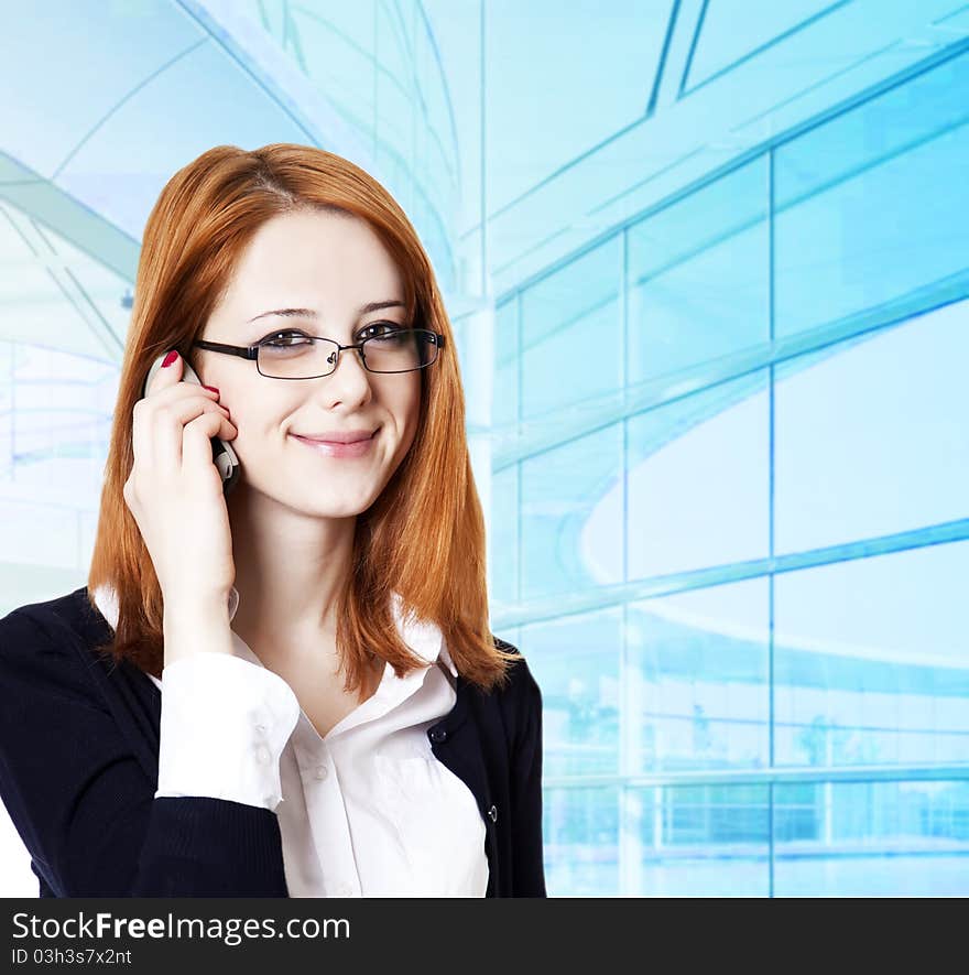 Business women calling by phone. Studio shot.