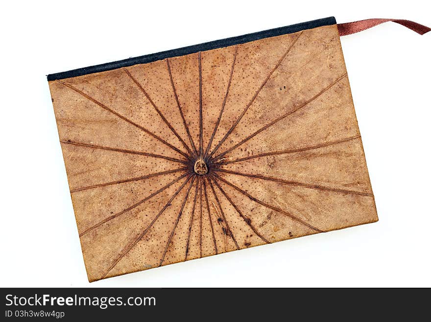 Dry lotus leaf book on a white background