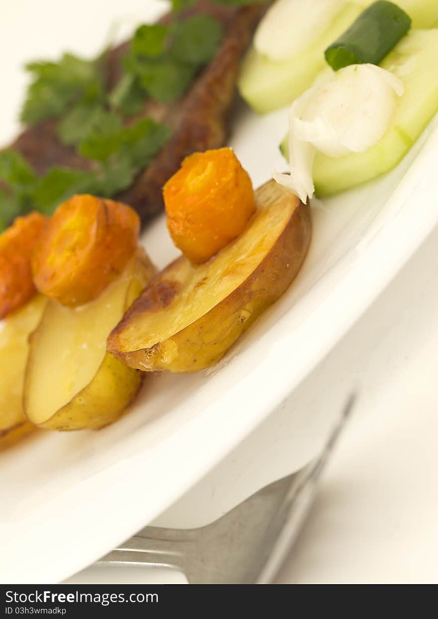 With roasted potatos, caroot and meat. With roasted potatos, caroot and meat