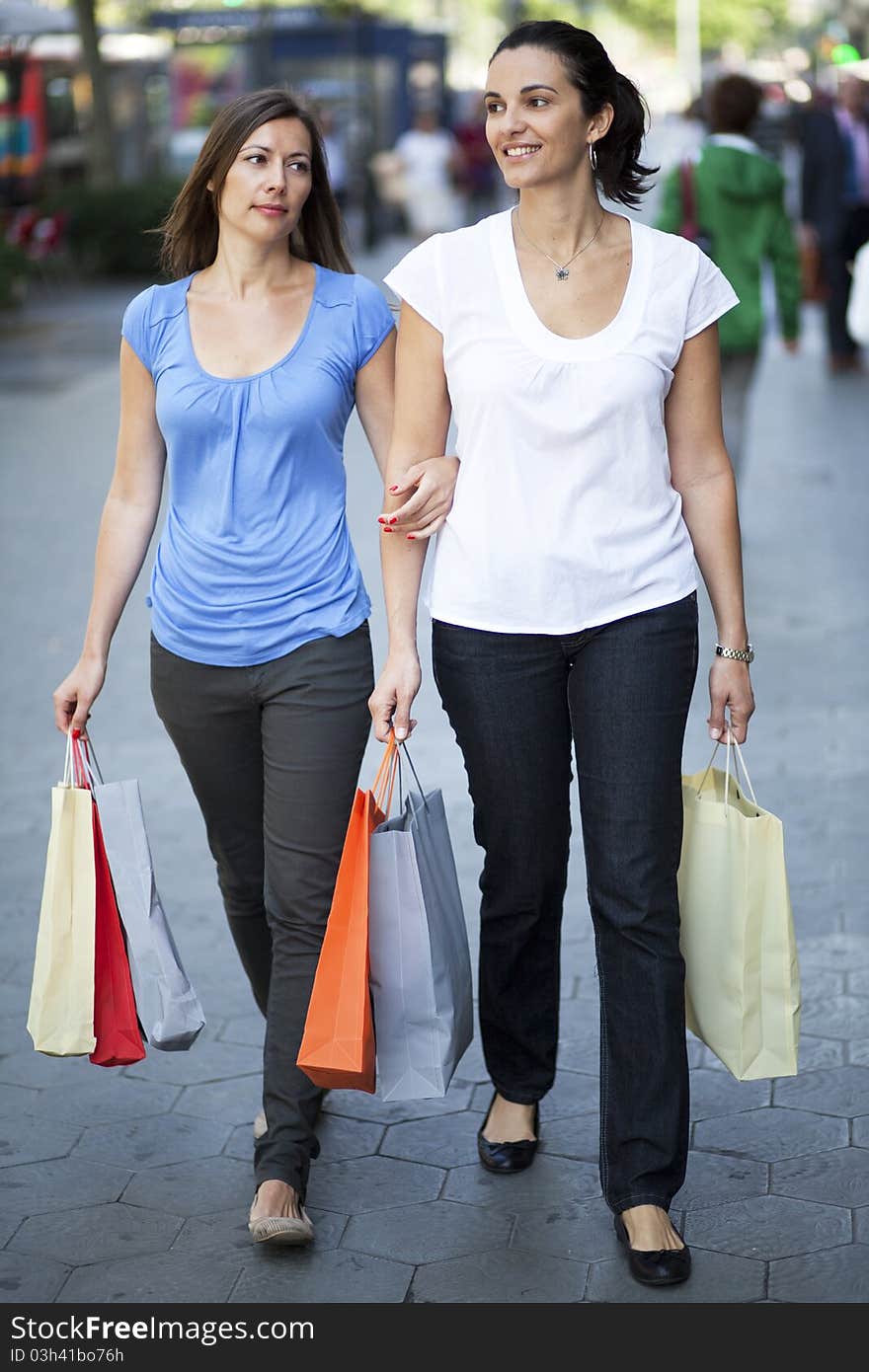 Two women with bags shopping. Two women with bags shopping