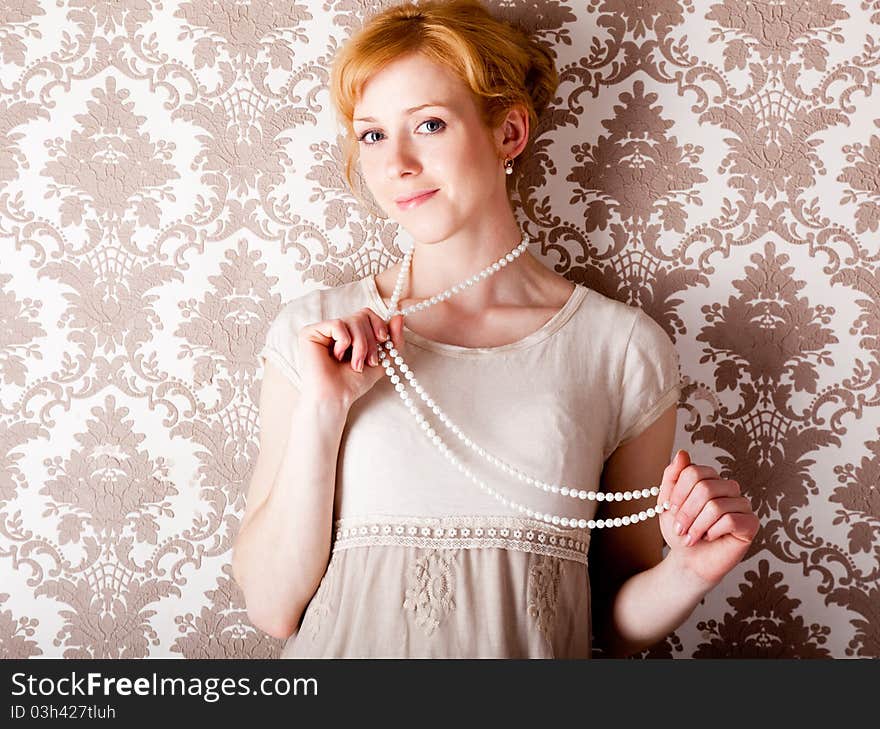 A beautiful smiling woman with beads