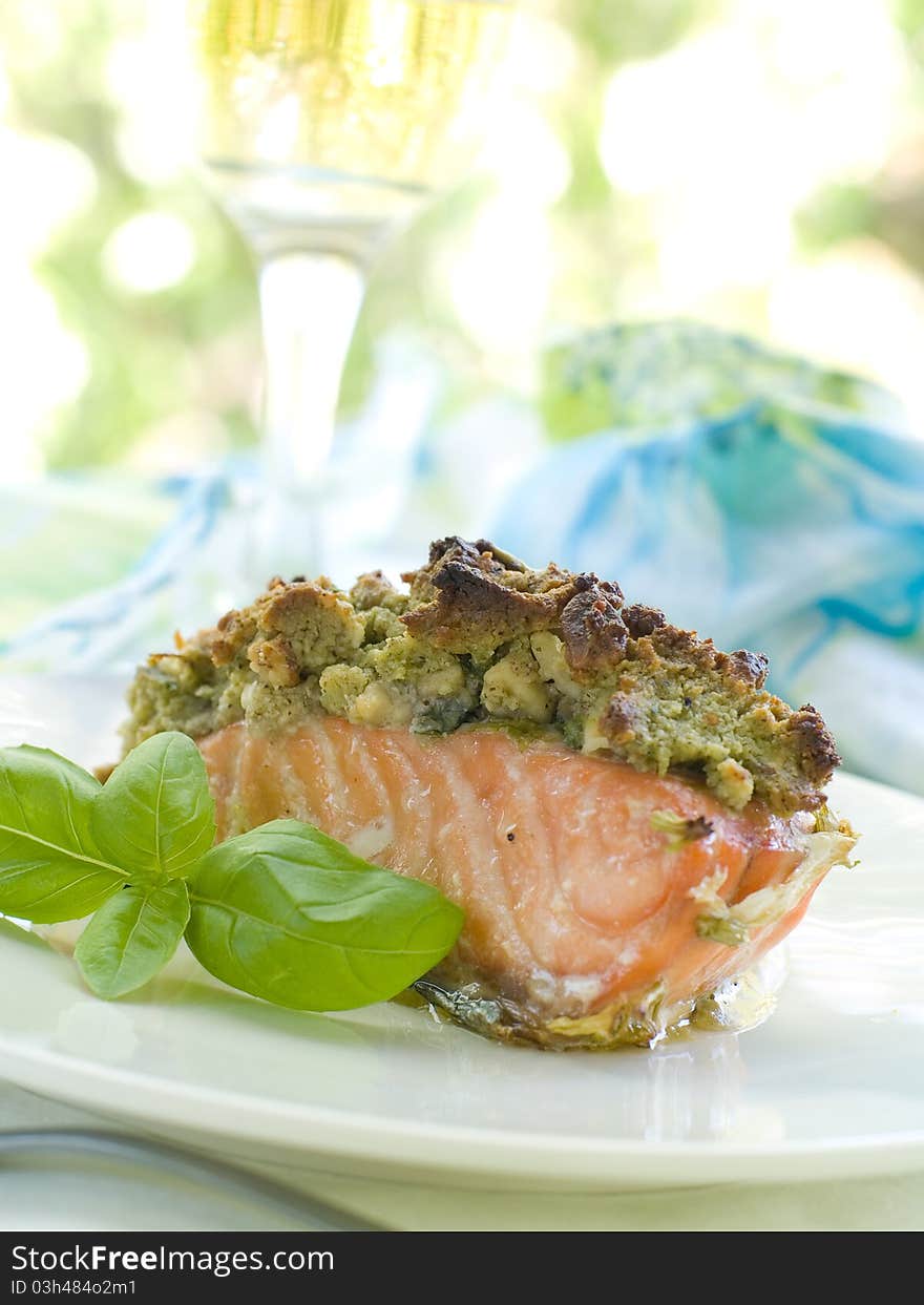 A grilled salmon fillet with basil  and wine