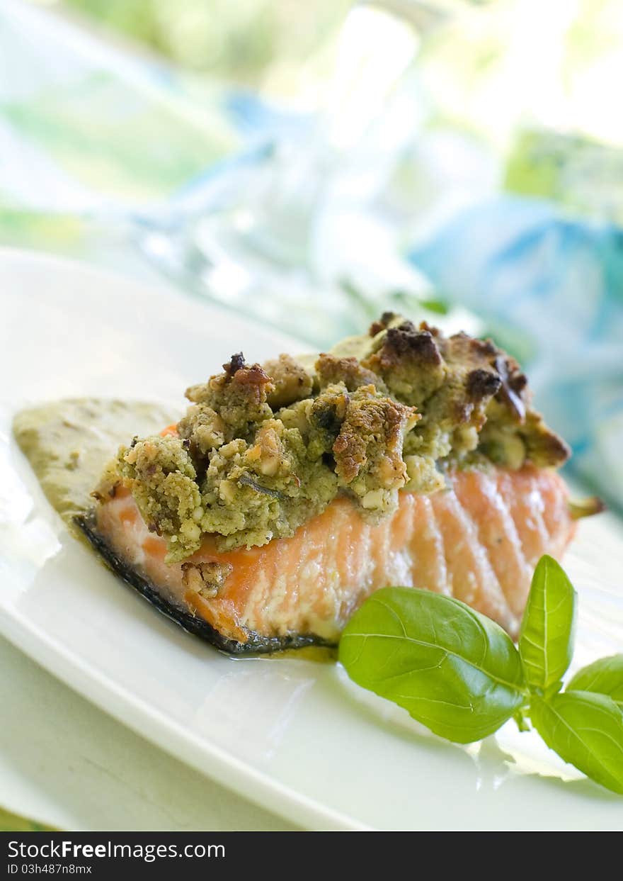 A grilled salmon fillet with basil and wine