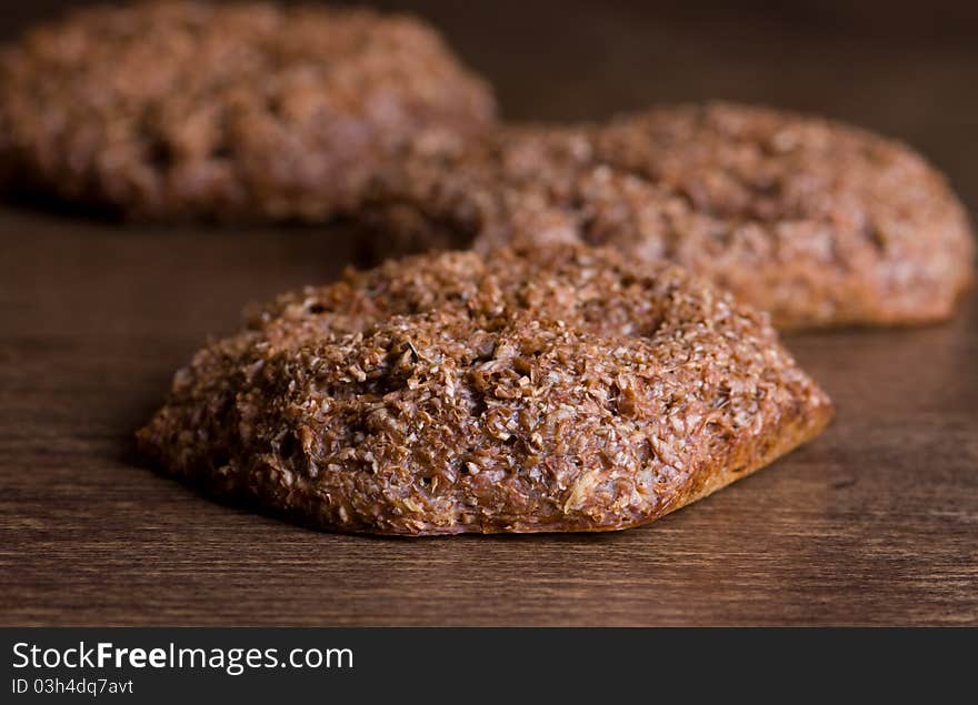 Homemade bran bread(buns) on wooden table