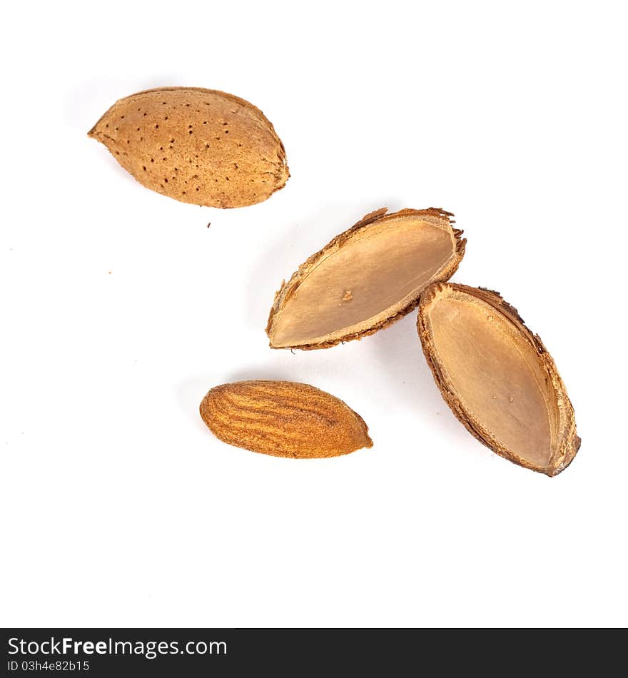 One opened and ona close almond nut on white background