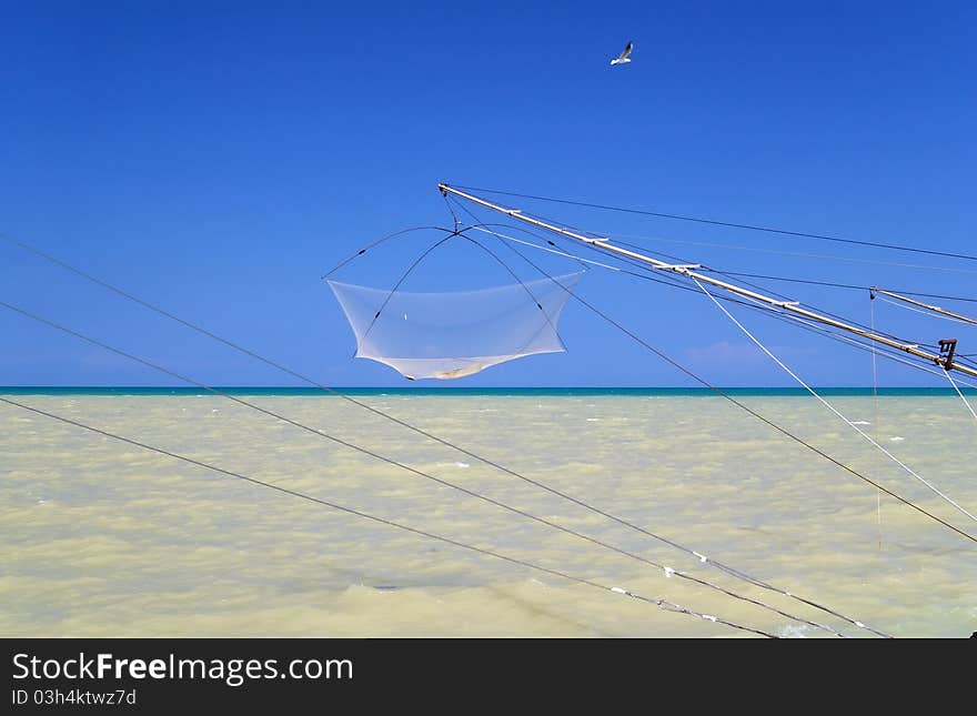 Fishing net at sea with clear blue sky