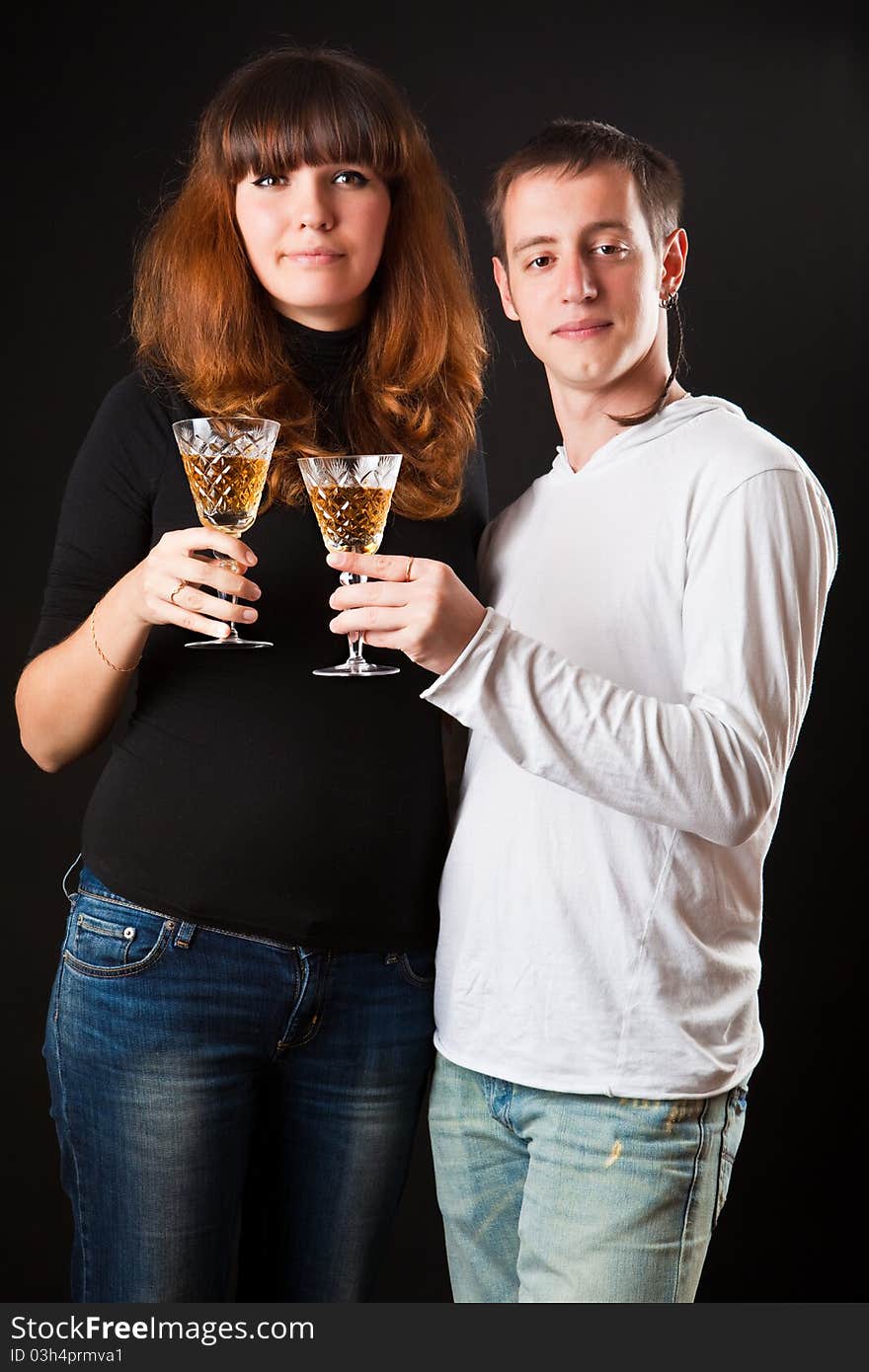 Couple of glasses of wine on a black background. Couple of glasses of wine on a black background