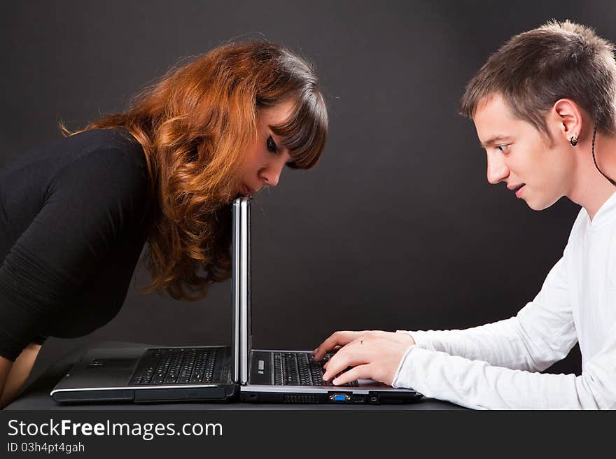 A girl looks at a laptop screen. A girl looks at a laptop screen