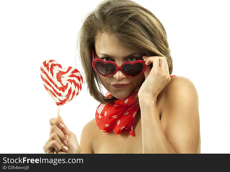 Sexy woman with heart shaped lollipop