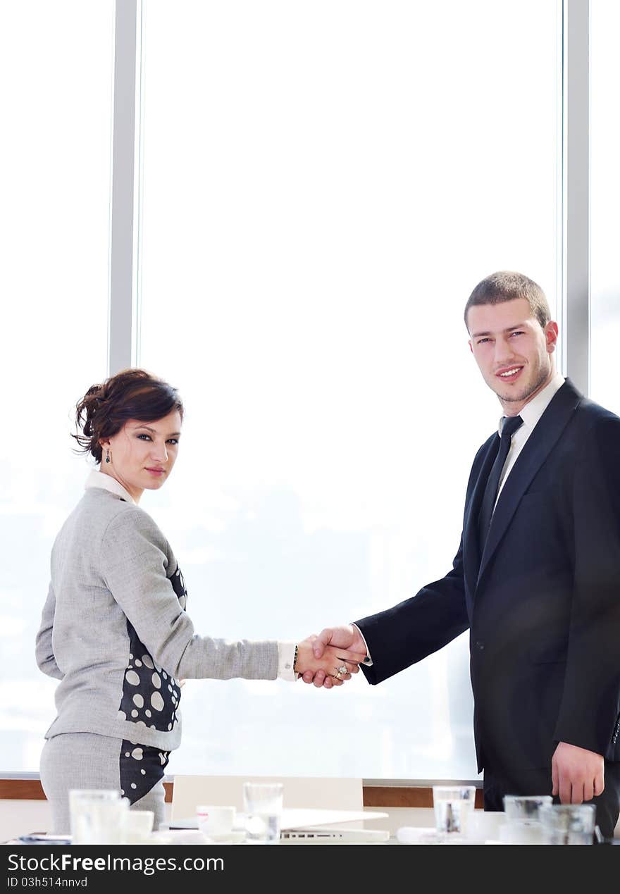 Two young businessman handshake on business meeting at modern office and representing success