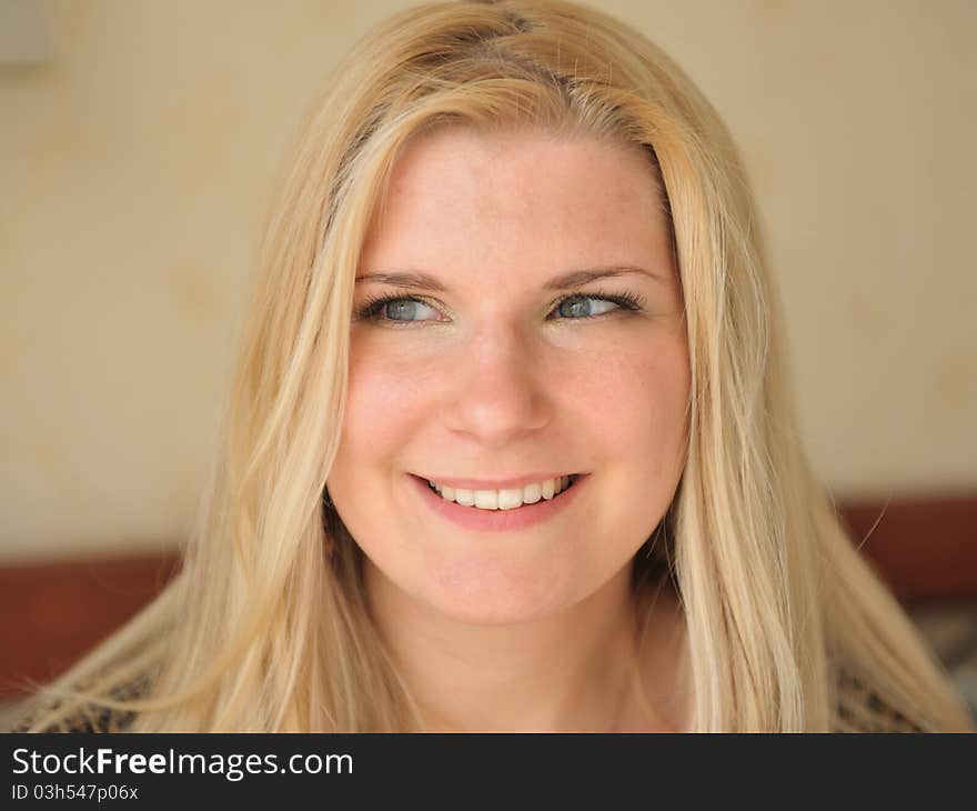 Pretty casual smiling woman portrait indoors. Pretty casual smiling woman portrait indoors