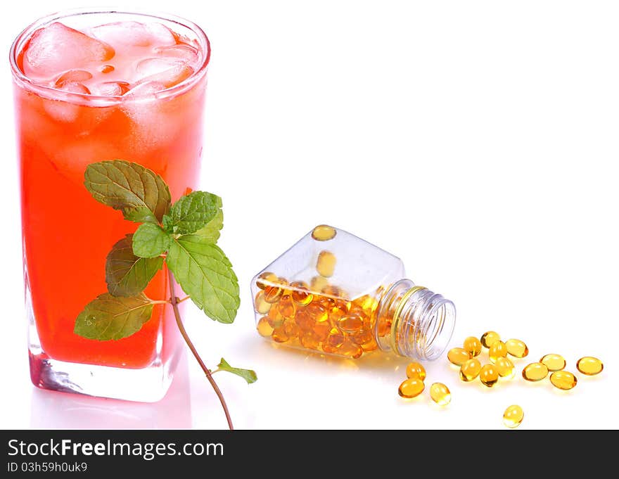 Concept image of healthy diet juice and vitamin pills.