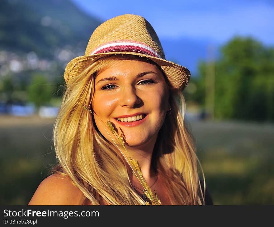 Beautiful summer female portrait with hat