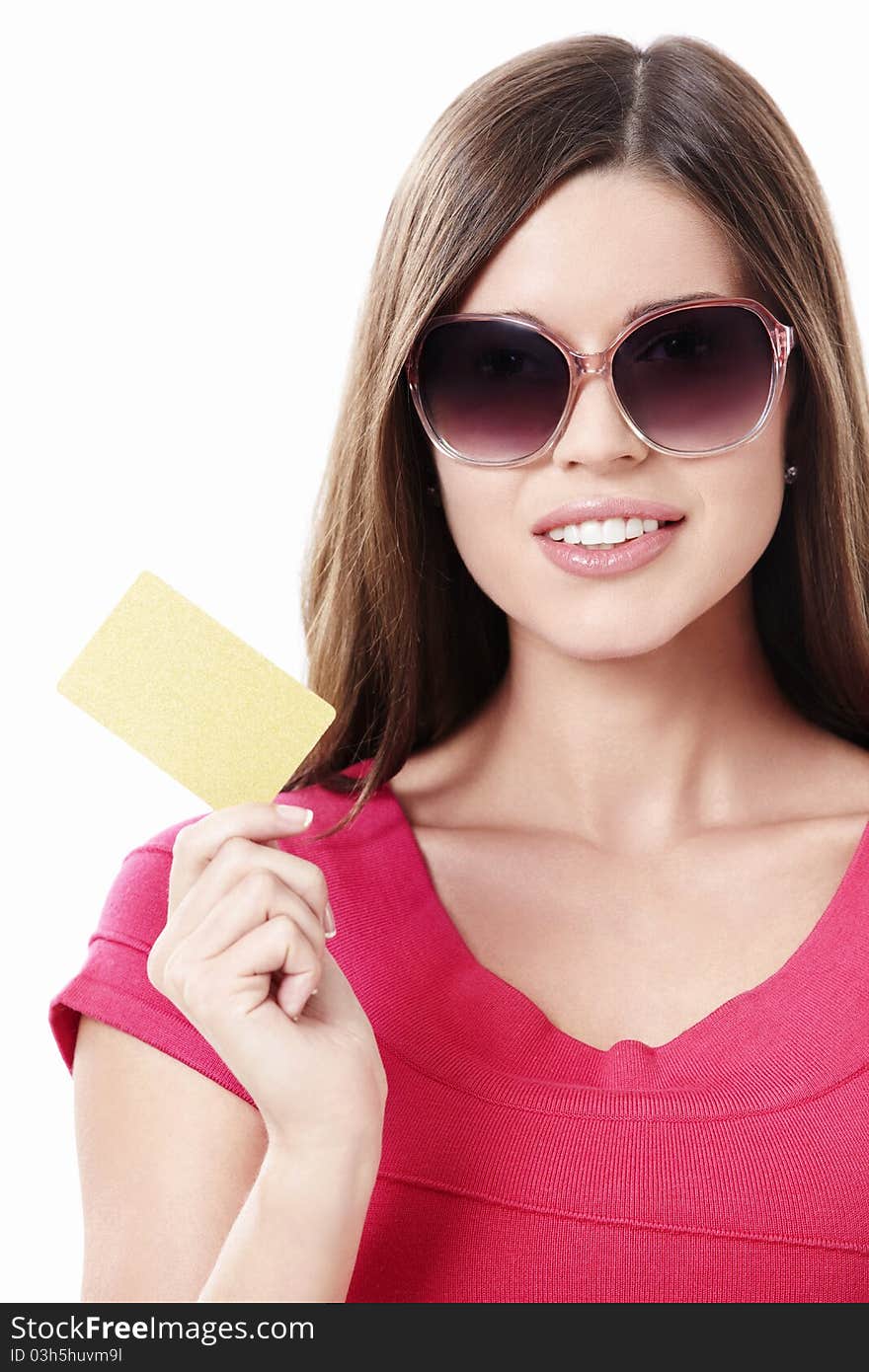 Young girl in sunglasses with a credit card on a white background. Young girl in sunglasses with a credit card on a white background