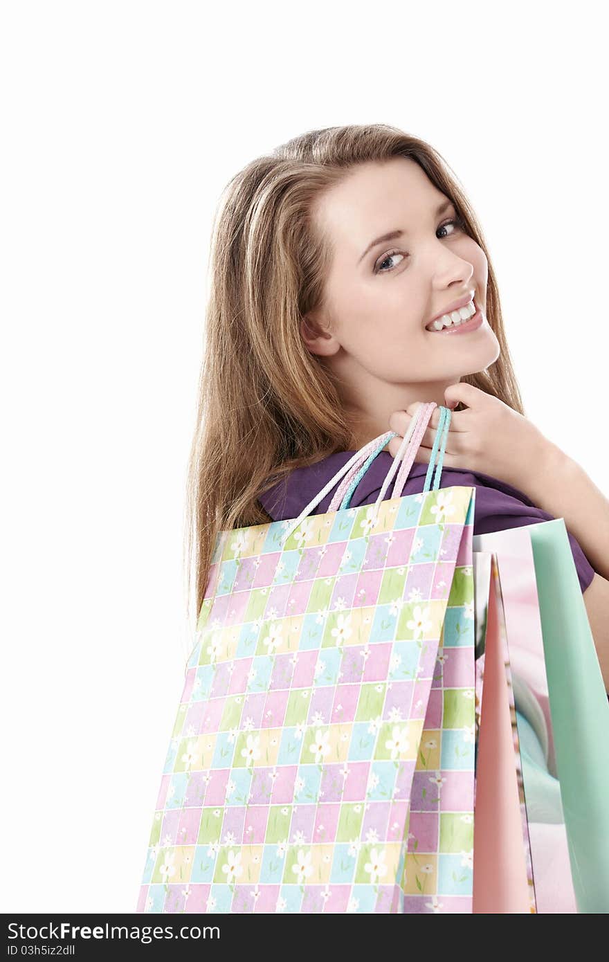 Young girl with shopping bags on white background. Young girl with shopping bags on white background