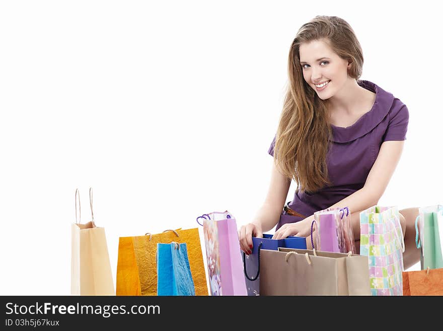 Attractive girl with shopping bags on white background. Attractive girl with shopping bags on white background