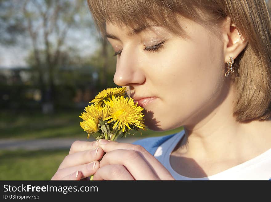 Girl and dandelions